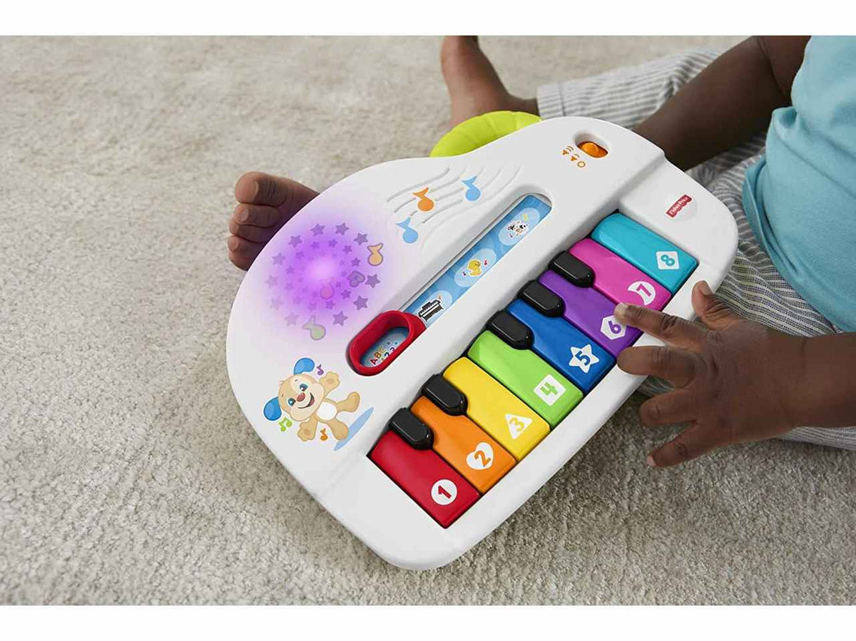 Fisher Price pianoforte di cagnolino multilingua