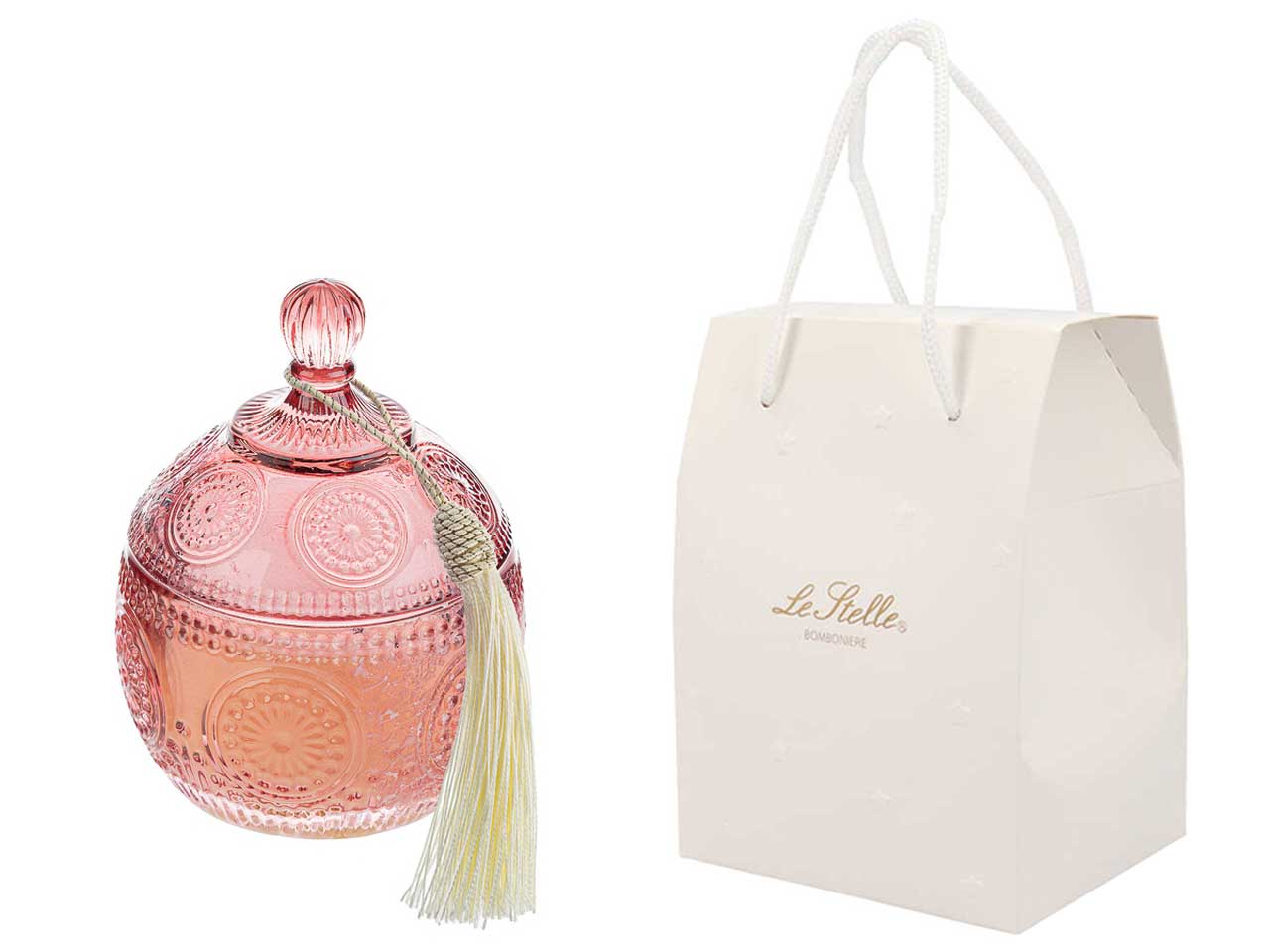 Candela profumata magnolia e fresie, vasetto con coperchio in vetro decorato a rilievo rosa con shopper avorio 8,5xh.12,5 cm - le stelle