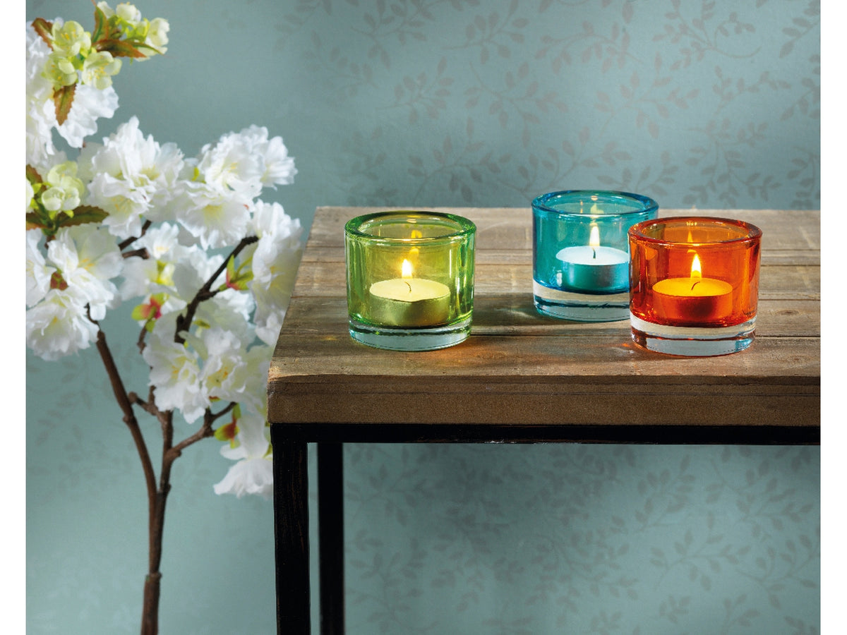 Portatealight in vetro trasparente in 6 colori assortiti diametro 6,5cm x altezza 5,7cm