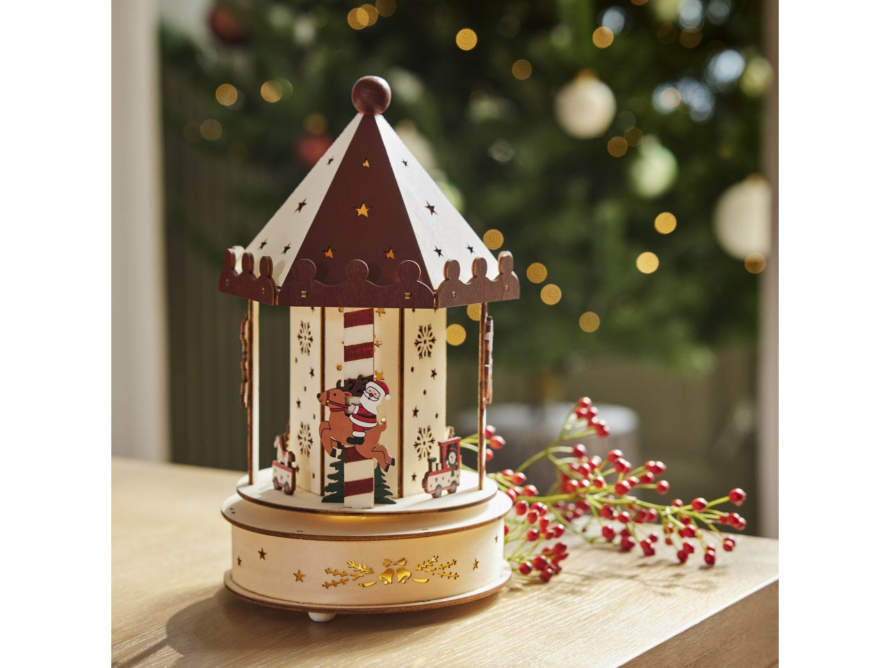 Giostrina 26cm in legno con led e movimento a batteria 15xh.26cm