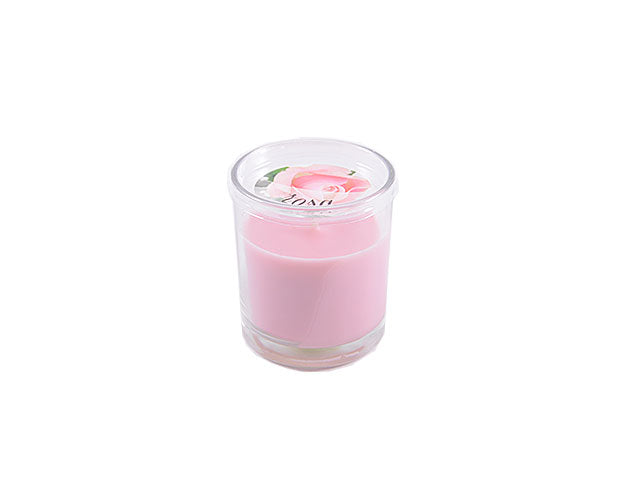 candela profumata in bicchiere rosa