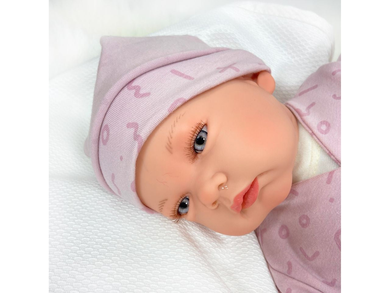 Bambola celia premium reborn colore malva