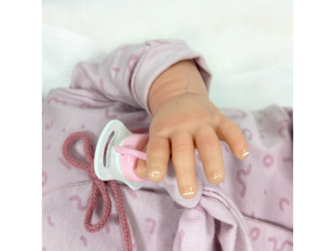 Bambola celia premium reborn colore malva